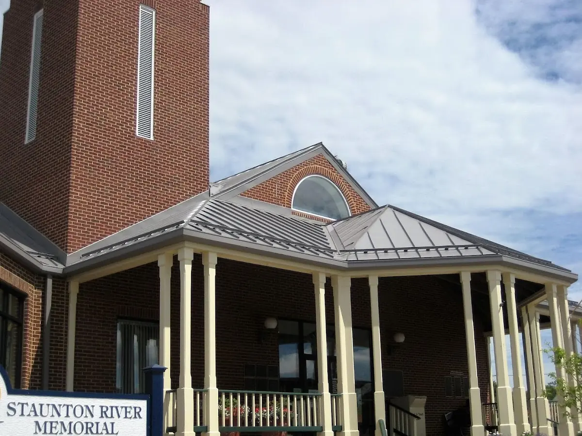 Skilled roofing craftsmen working on a residential roof in Independence